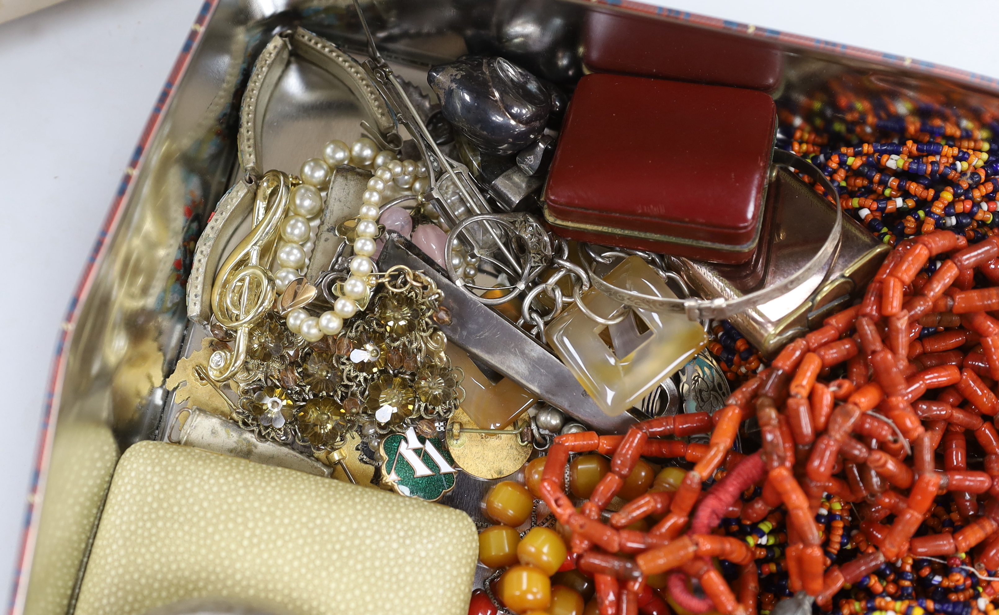A group of assorted costume jewellery, including an orange zircon? ring.